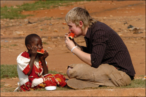 Tom and a little child eatin' watermelon.jpg