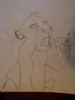Simba eating a  bug